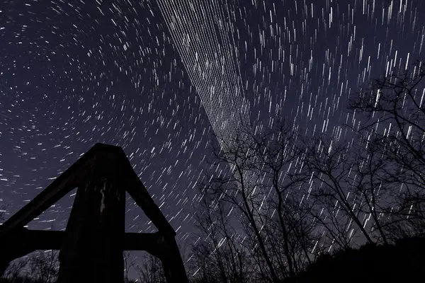 A composite, long-exposure image of Starlink satellites, the straight lines, seen over the concrete base of an old energy plant in Salgotarjan, Hungary, last month.