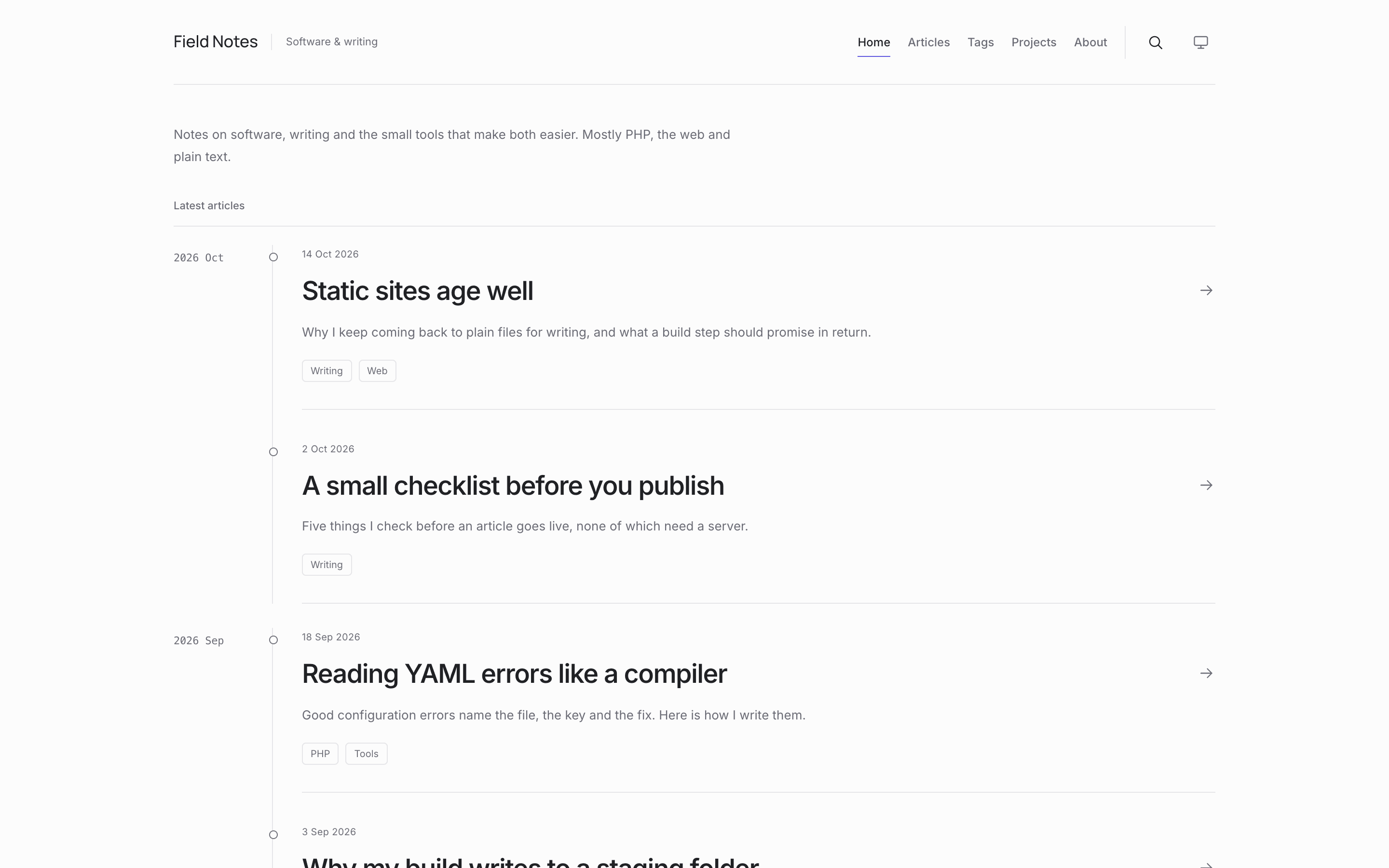 The home page of a Verse website in the default theme: the site description, then the latest articles in a timeline grouped by month, each with its date, description and tags.