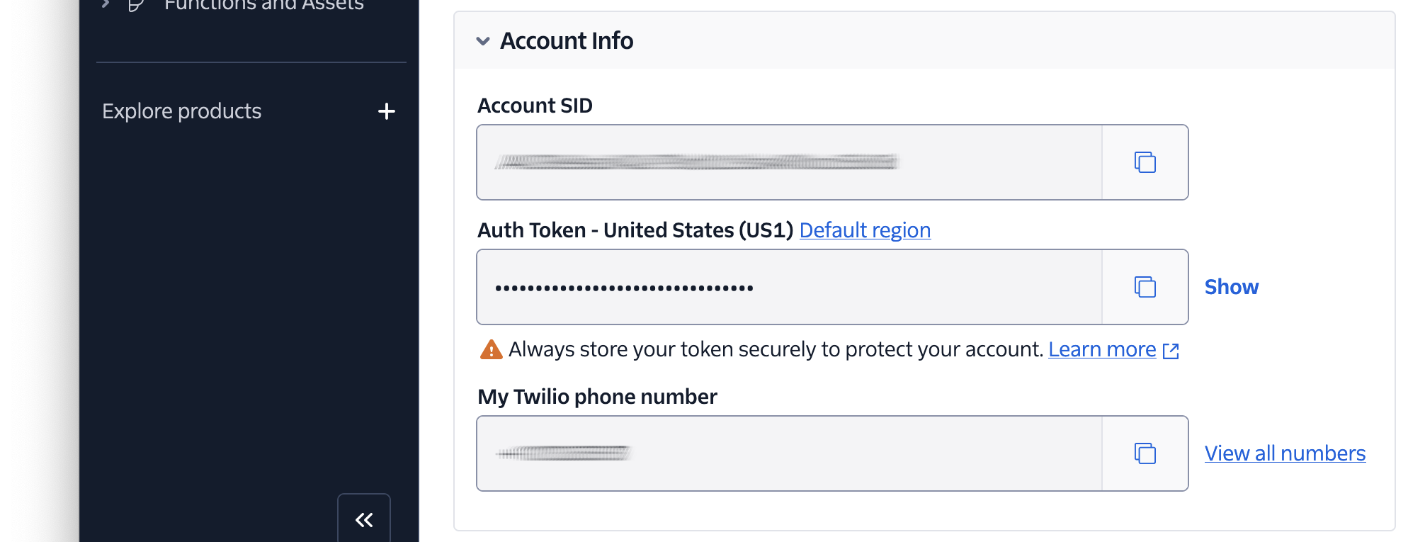 The Twilio Console's Account Info panel, with the Account SID and My Twilio phone number field's redacted.