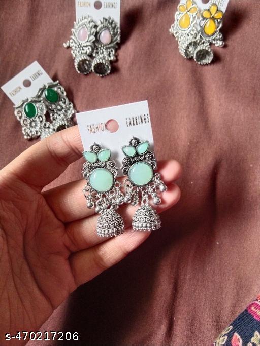 These stunning oxidized silver jhumkas feature vibrant red, green, and pink hues, perfect for festive occasions. Their intricate designs complement any outfit, adding a touch of elegance and tradition, making them an ideal accessory for celebrating in style - ZORA