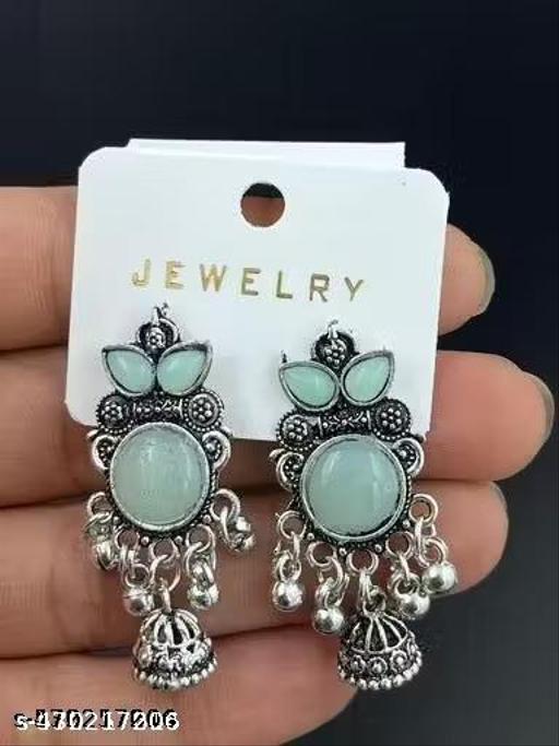 These stunning oxidized silver jhumkas feature vibrant red, green, and pink hues, perfect for festive occasions. Their intricate designs complement any outfit, adding a touch of elegance and tradition, making them an ideal accessory for celebrating in style - ZORA